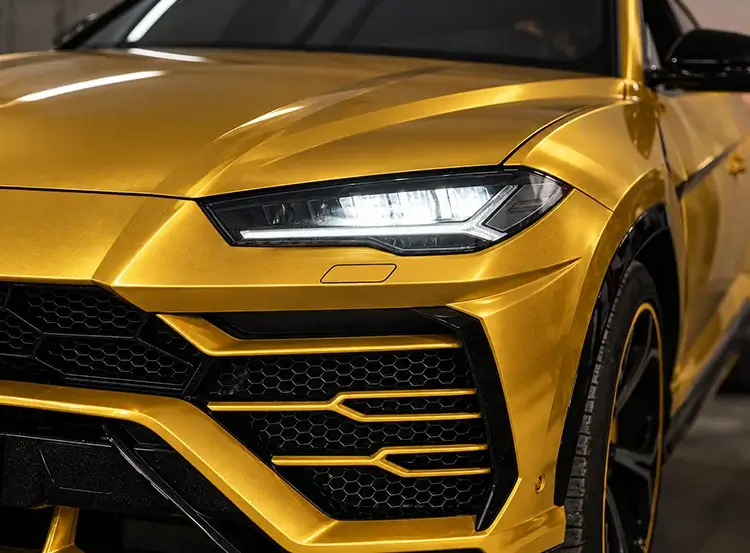 Gold wrapped luxury SUV showing a custom color change vehicle wrap