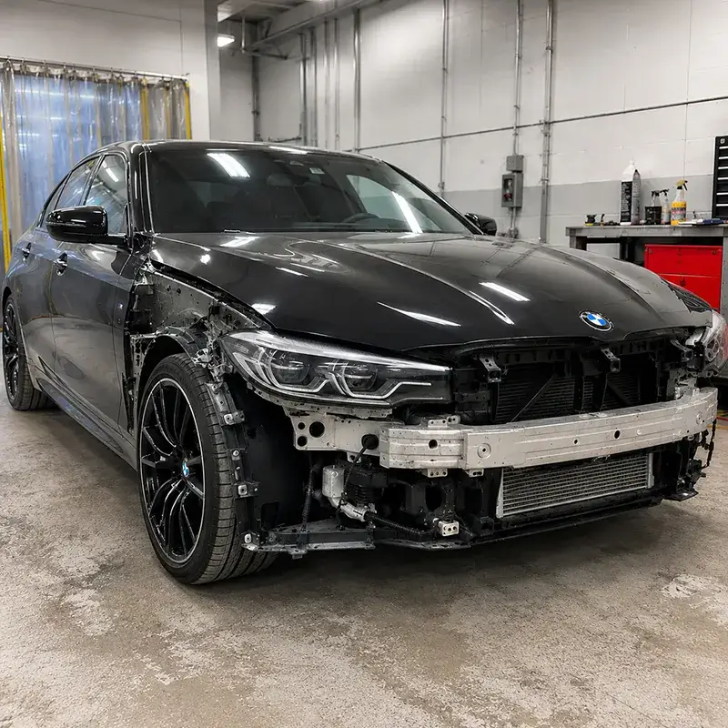 BMW undergoing collision repair at Fireplace Auto Collision